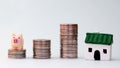 Stacks of coins and miniatures. Royalty Free Stock Photo